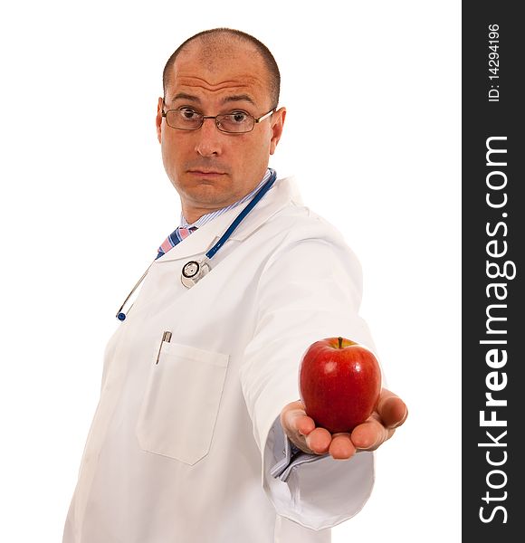 Doctor Holding Out An Apple On White Background