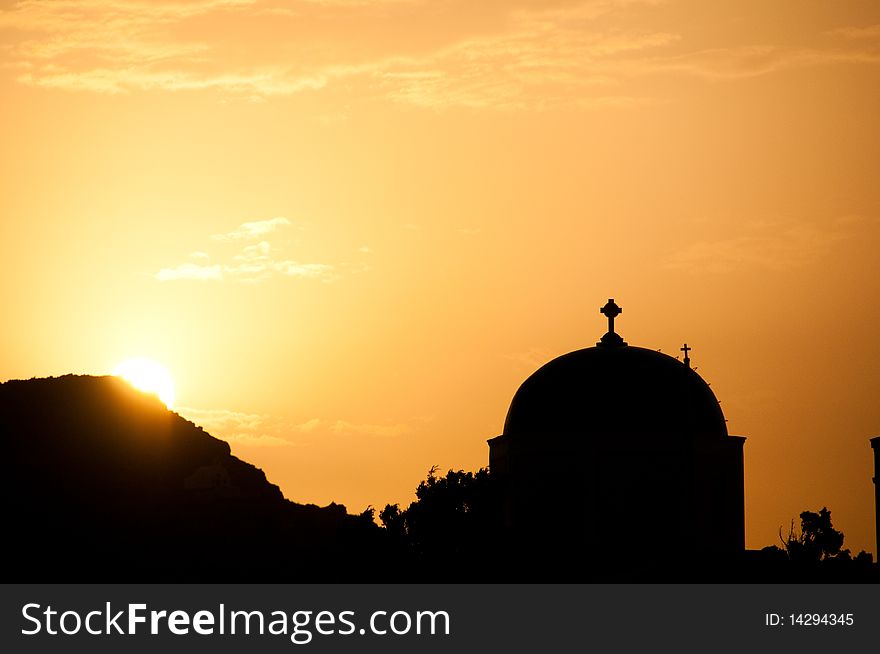 Greek church in santorini greece with a cross