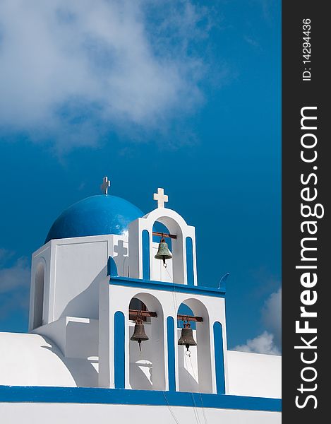 Greek church in santorini greece with a cross