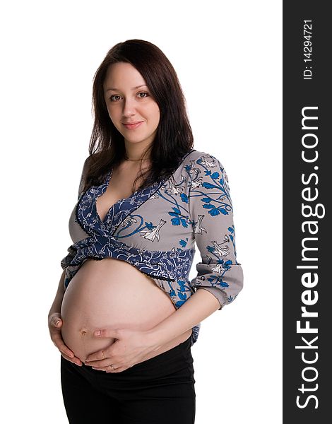 Pregnant woman embracing her stomach isolated on white. Pregnant woman embracing her stomach isolated on white