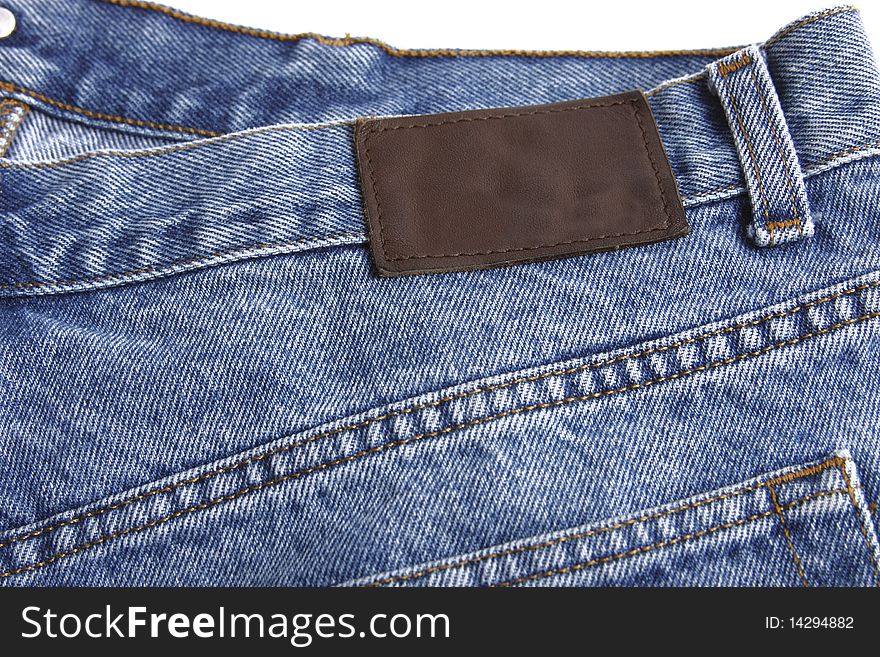 Denim blue jeans rear with blank label and white background. Denim blue jeans rear with blank label and white background