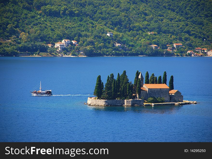 Sailing boat on blue sea