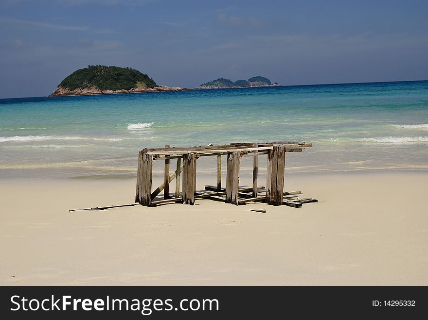 Wood wreck of small stair on a tropical beach in Malysia. Wood wreck of small stair on a tropical beach in Malysia