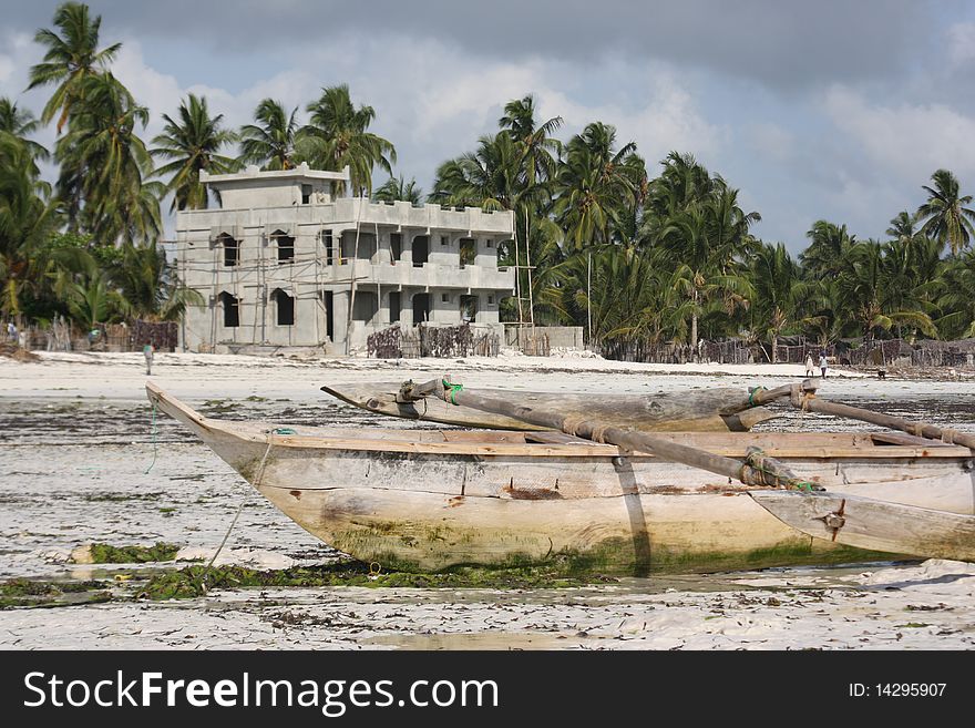 Dhow and local home on Zanzibar beach