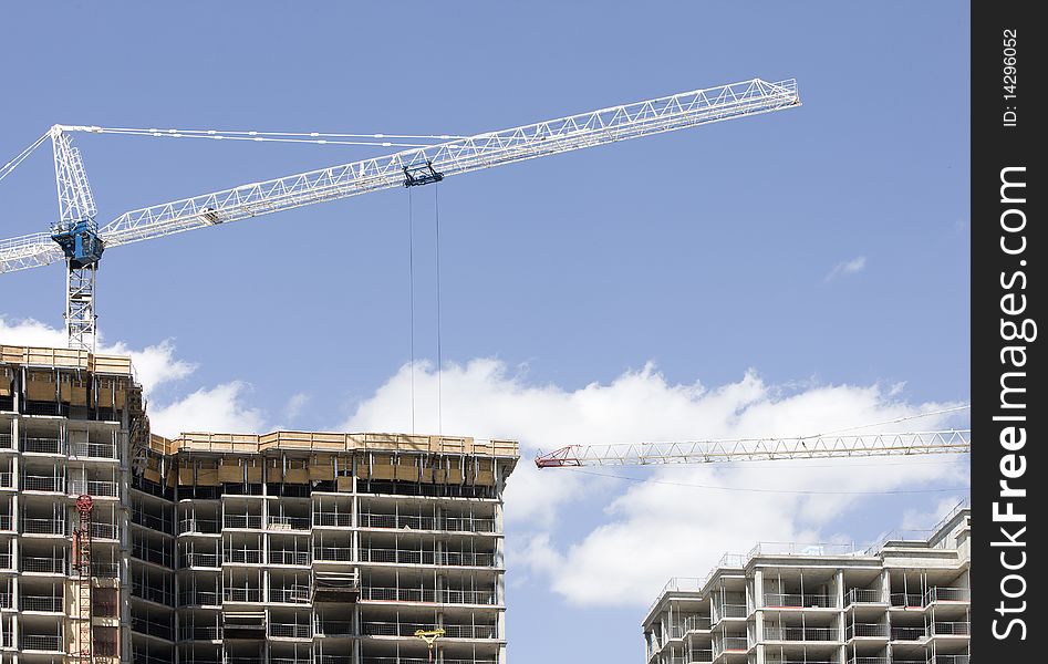 Unfinished / under construction apartment building against a blue sky