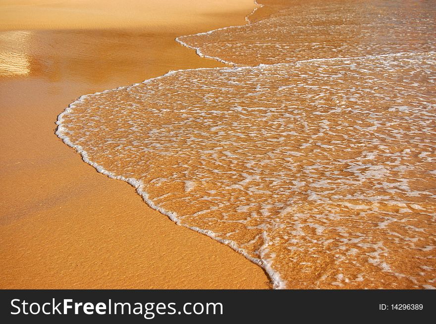 Background of wave on sand of the tropical beach