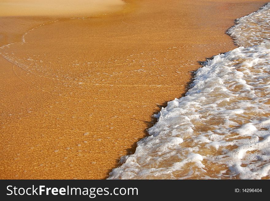 Background of wave on sand of the tropical beach
