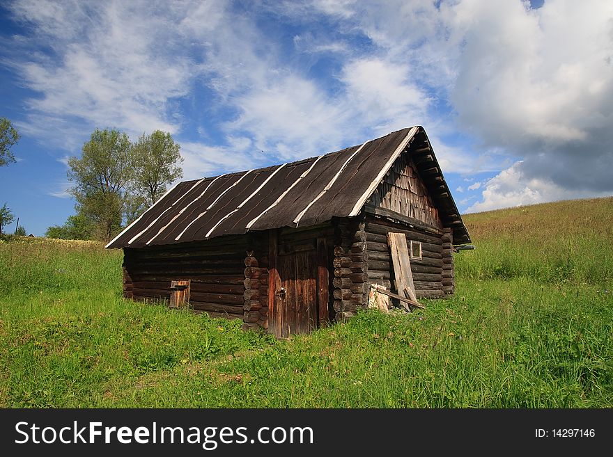 Russian black bath house in a field. Russian black bath house in a field.