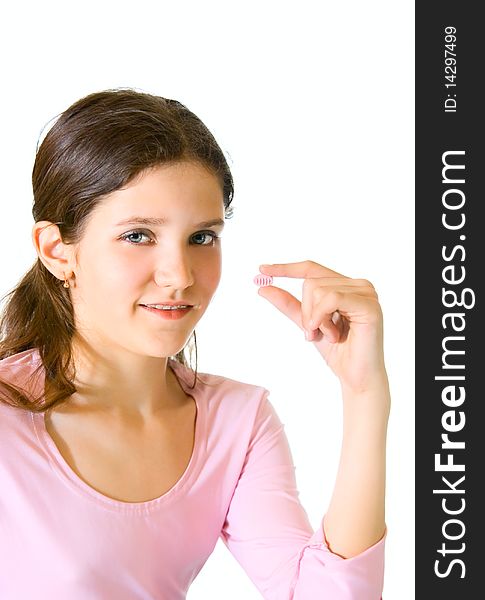 Lovely teen girl in pink with pill. Lovely teen girl in pink with pill