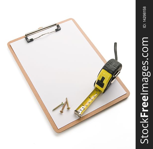 Tape measure and screws laying on blank clipboard. Tape measure and screws laying on blank clipboard.