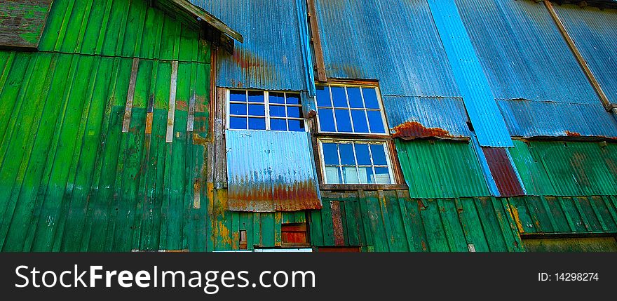 The colorful side an old tin building used for industrial parts storage in Aurora Oregon. The colorful side an old tin building used for industrial parts storage in Aurora Oregon