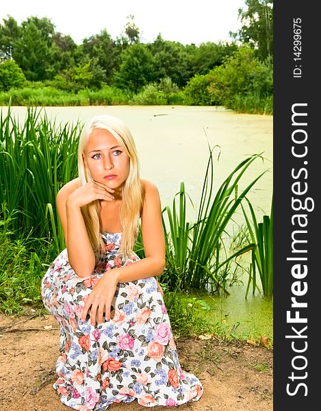 Blonde girl near the lake. Blonde girl near the lake