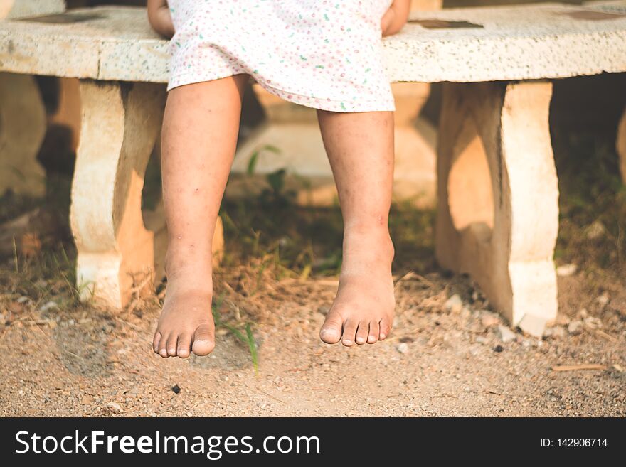 Asian girl sitting over marble bench