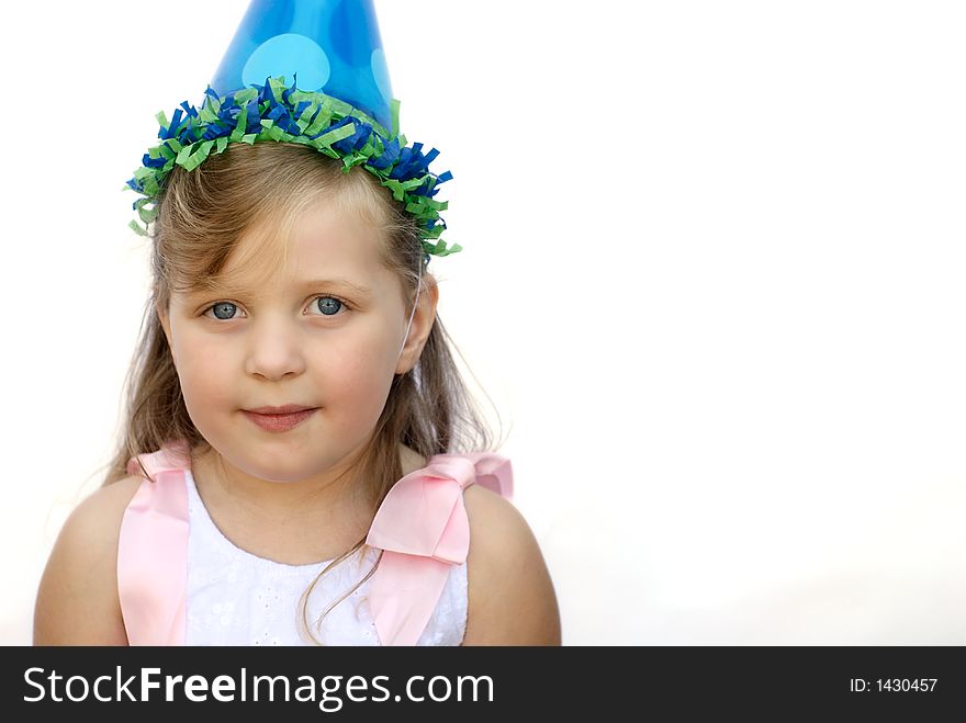 Happy young girl wearing party hat on white background