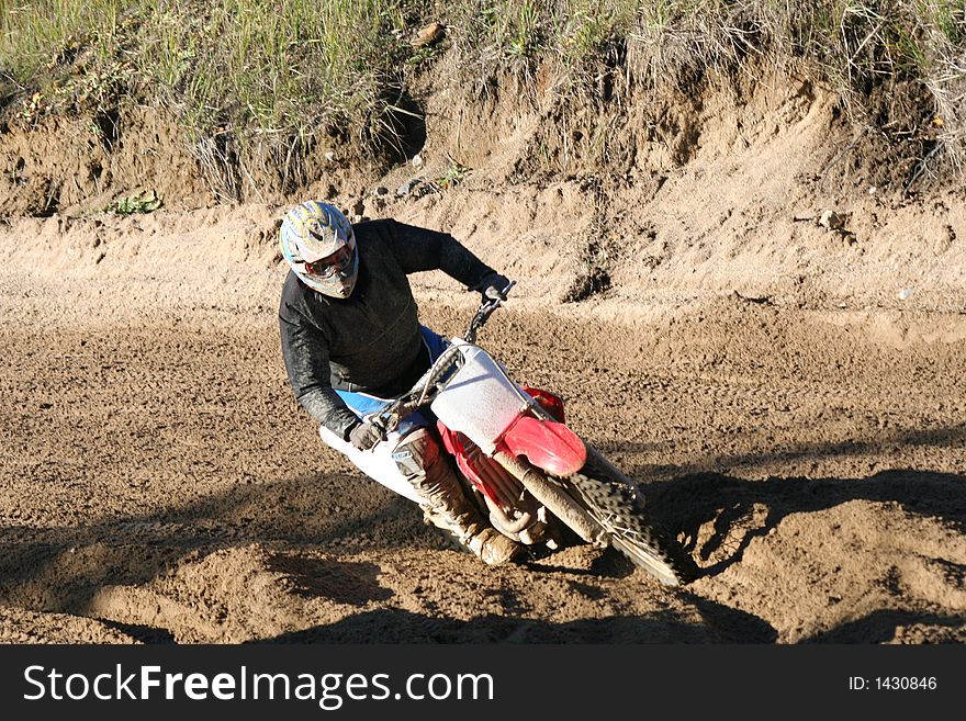 Racing rider on the bend. Racing rider on the bend