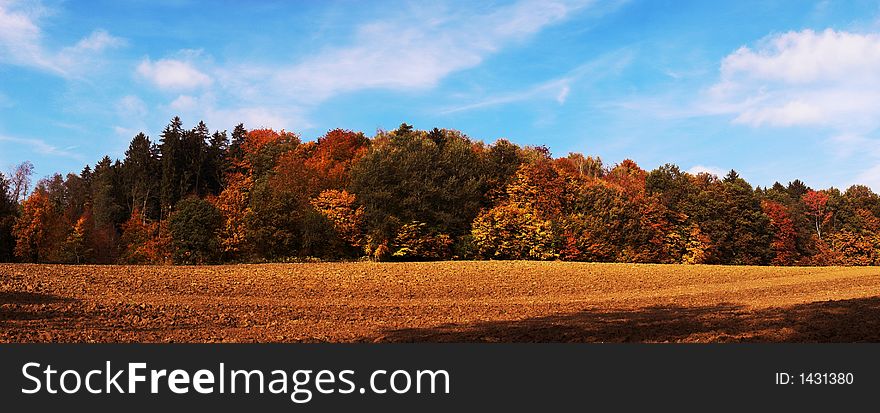 Colorful Panorama Autumn landscape with blue sky
