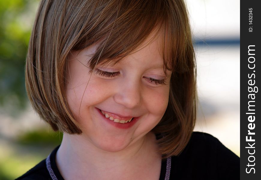 Happy Smiling Girl Looking Down