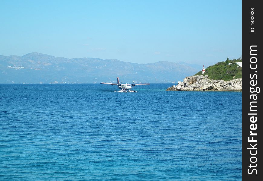 Sea plane taxing to take-off from the sea