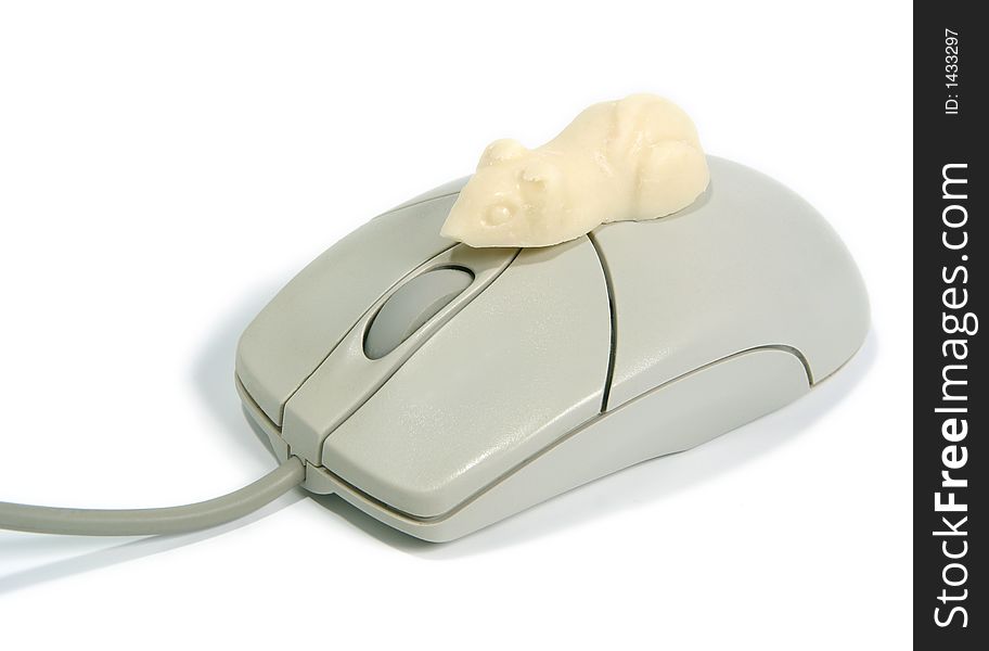 Chocolate mouse sitting on a computer mouse - on white. Chocolate mouse sitting on a computer mouse - on white