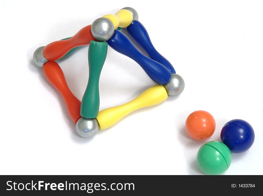 Color balls and a metal ball on white background created a pyramid, isolated. Color balls and a metal ball on white background created a pyramid, isolated