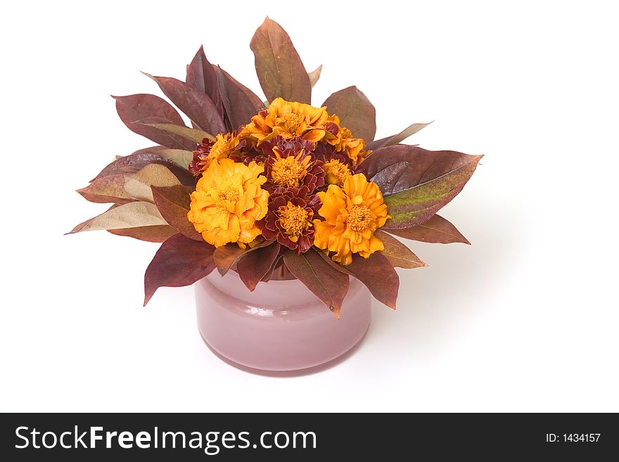 Composition of autumn flowers and leaves placed in ping pot. Composition of autumn flowers and leaves placed in ping pot