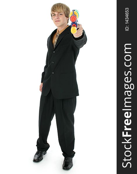 Handsome teen boy in suit with water gun.