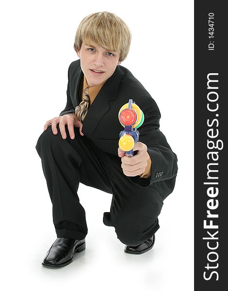 Handsome Teen boy in suit with water gun.