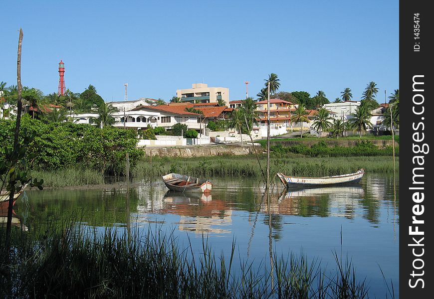 Small coastal city with lighthouse