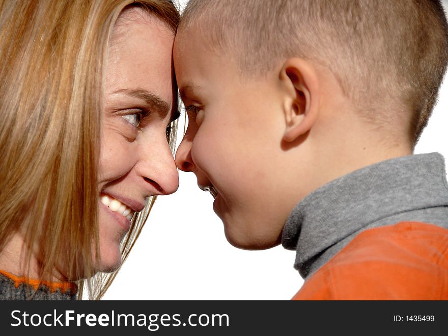 Mother and son touching heads and smiling