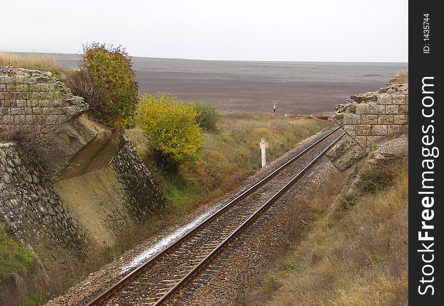 Railroad track passing trough a narrow gap