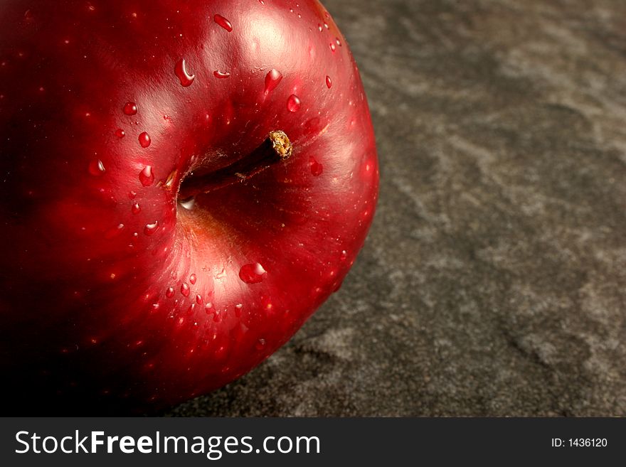 Single Red Apple on Grey Stone