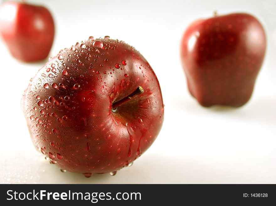 Three Juicy Red Apples With Shallow Depth of Field. Three Juicy Red Apples With Shallow Depth of Field