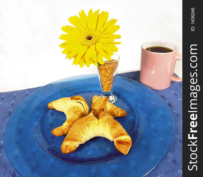 French style breakfast croissants or horns served with a black cup of coffee. French style breakfast croissants or horns served with a black cup of coffee