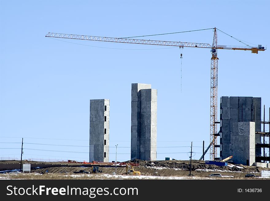 Crane over new construction of large building. Crane over new construction of large building