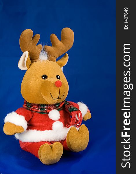 Kids christmas toy reindeer on blue