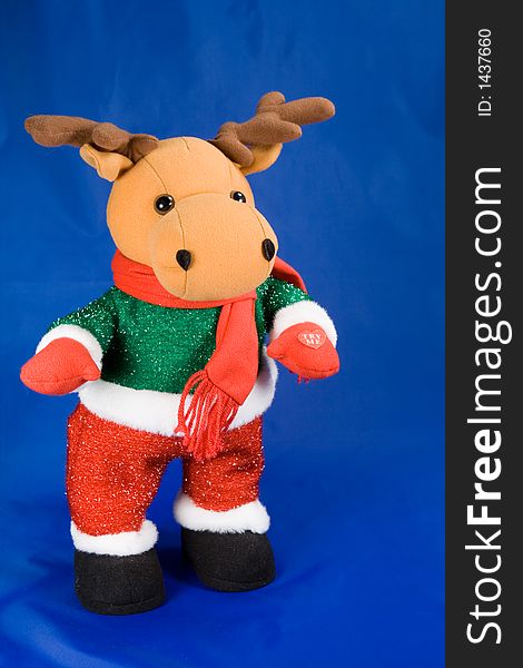 Kids christmas toy reindeer on blue