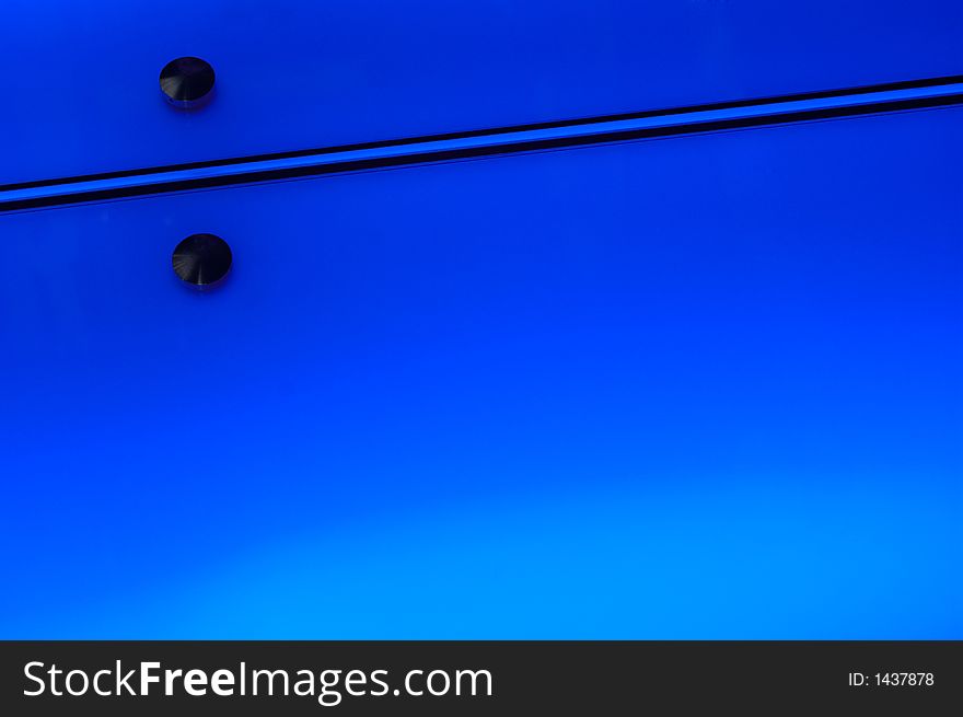 Close-up of a joint between two illuminated display panels with detail on the rivets holding them in place. Abstract graphic image suitable for background. Close-up of a joint between two illuminated display panels with detail on the rivets holding them in place. Abstract graphic image suitable for background.