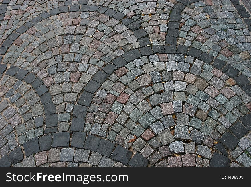 Fragment of the cobblestone road. The photo taken at the historical center of the Riga (Latvia, Europe). Fragment of the cobblestone road. The photo taken at the historical center of the Riga (Latvia, Europe)
