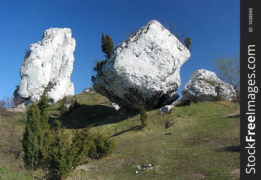 White limestone rocks moutain over blue sky. White limestone rocks moutain over blue sky.