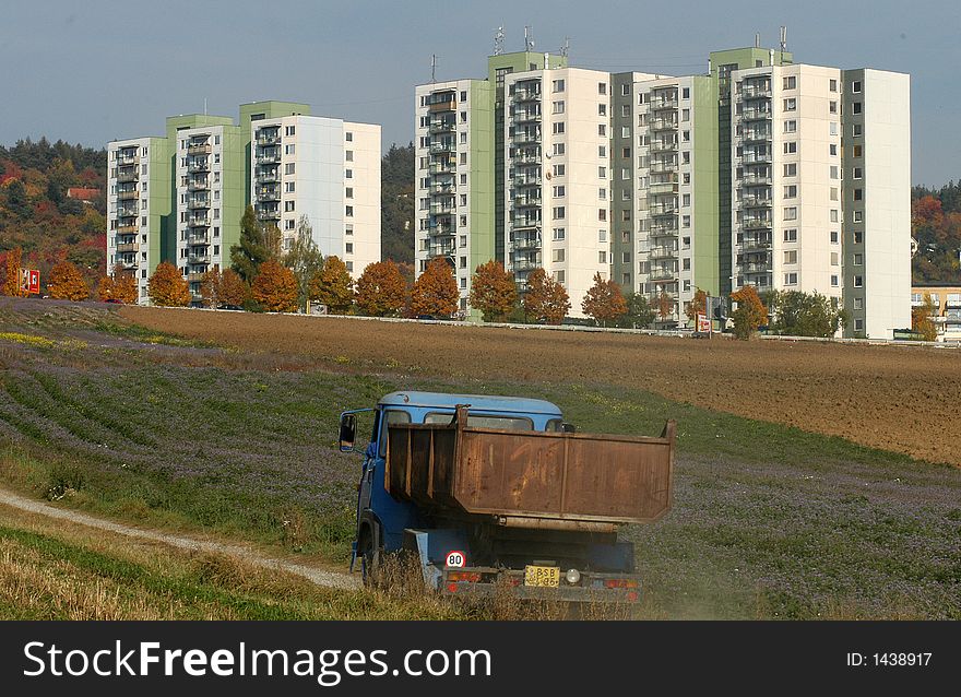 Many flats in suburb behind the city. Many flats in suburb behind the city