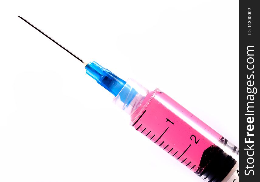 Syringe With Red Liquid on isolated white background