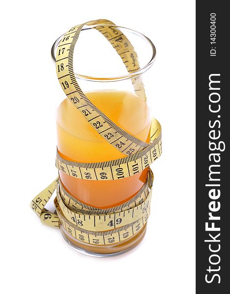 Glass of orange juice with measuring tape. Glass of orange juice with measuring tape.