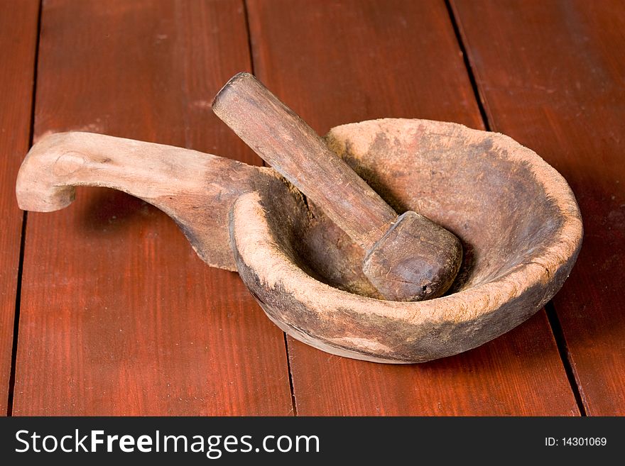 Wooden mortar and pestle on a table