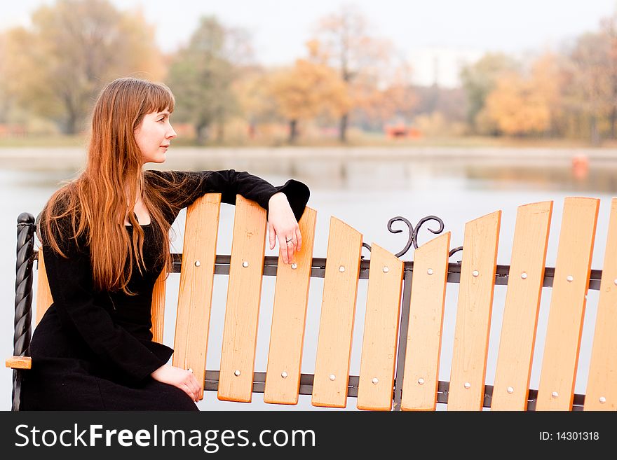 Portrait of lady in black dress in the park