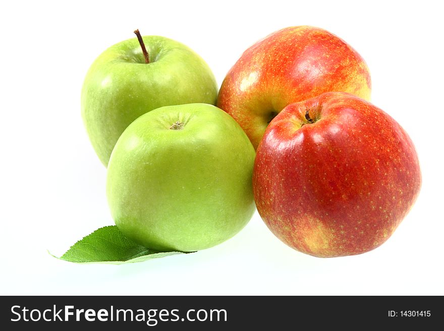 Ripe fresh red and green apples with leaf isolated on white