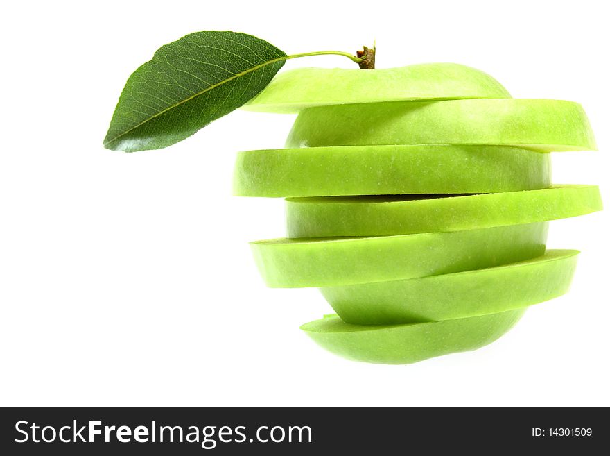 Ripe fresh green apple cut with leaf isolated on white