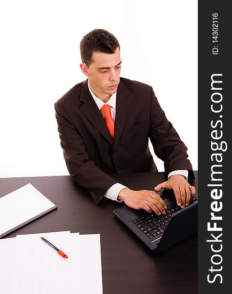 Businessman working on a laptop computer at the office