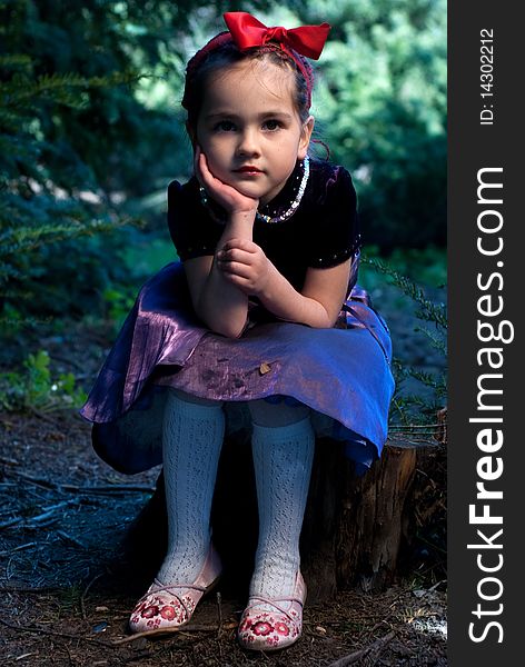 Snow white with apple, litle girl on a forest background