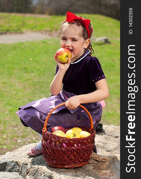 Snow white with apple, litle girl on a forest background