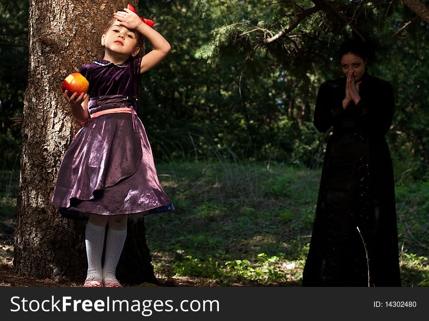 Stepmother gives poisoned apple give to snow white little girl. Stepmother gives poisoned apple give to snow white little girl